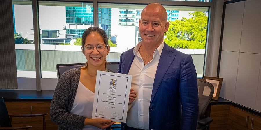 Dr Kristine Italia with her Australian Orthopaedic Association fellowship certificate