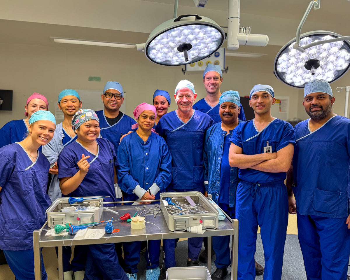 Nurses training with shoulder surgery implants and equipment